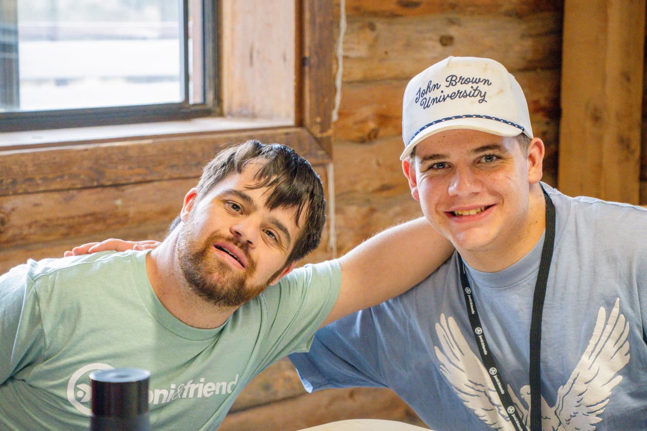Two men smiling and posing for the camera.