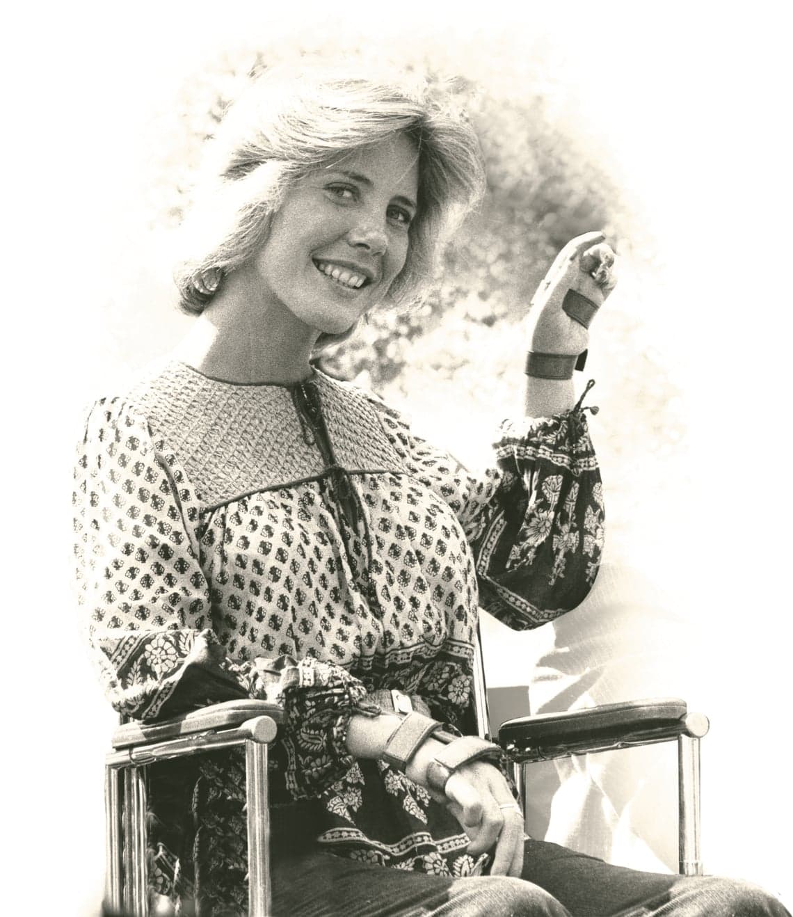 A younger photo of Joni Eareckson Tada in her wheelchair.
